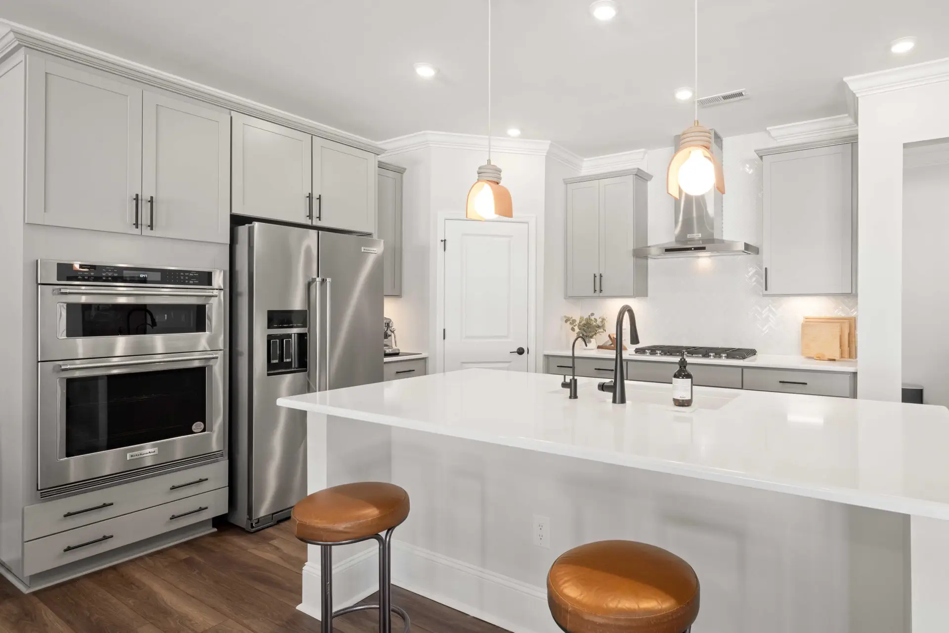 bright kitchen interior with white furniture and warm light